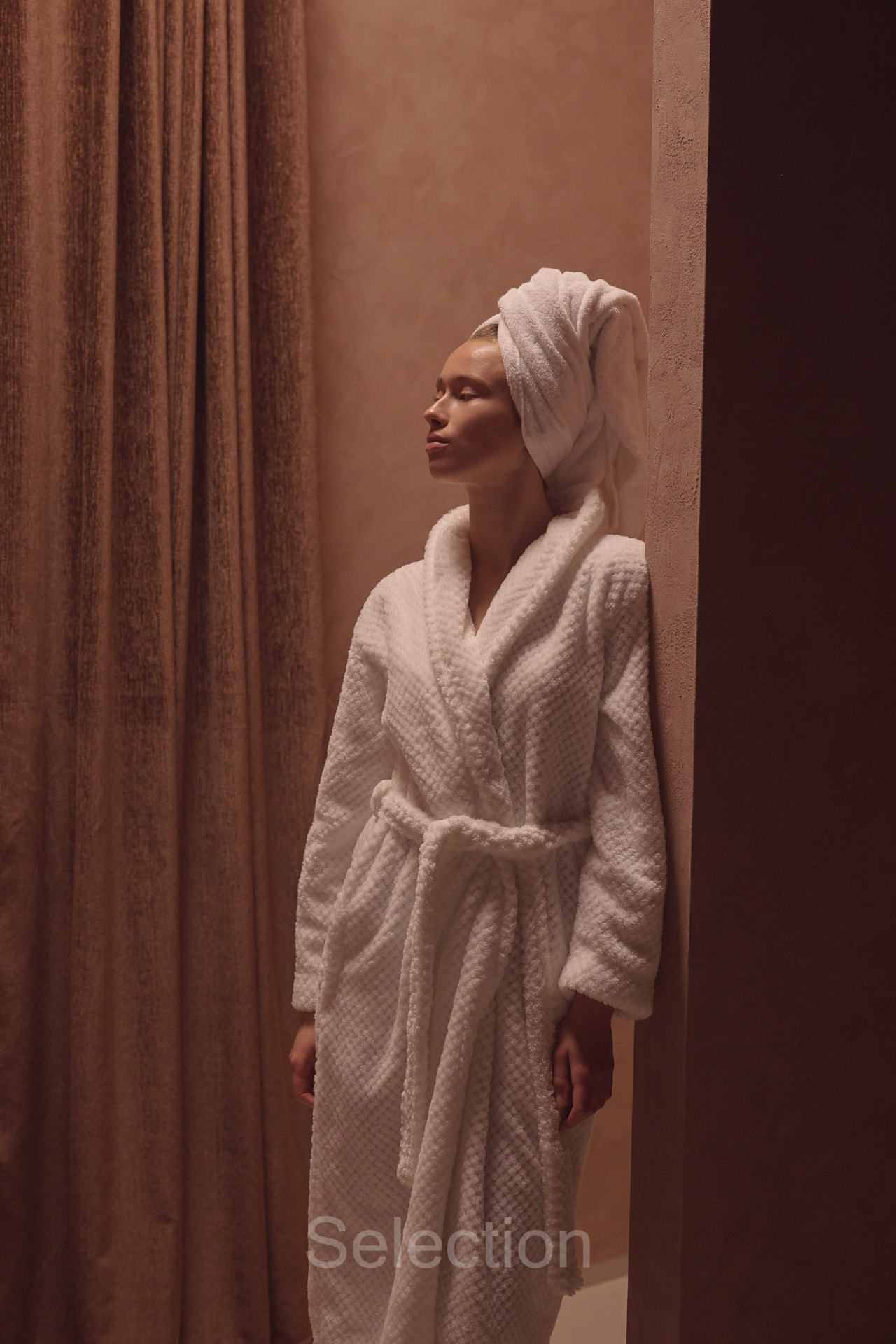 A guest in a robe at the entrance of Riad Maison